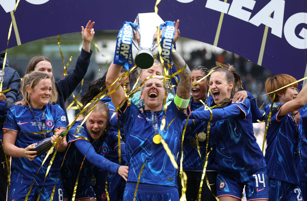 Millie Bright of Chelsea lifts the Subway Women's League trophy following victory in the Subway Women's League Cup Final match between Chelsea and Manchester City at Pride Park on March 15, 2025 in Derby, England.