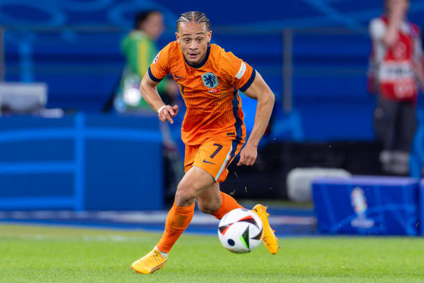 Xavi Simons BERLIN, GERMANY - JULY 6: Xavi Simons of the Netherlands runs with the ball during the Quarter-Final - UEFA EURO 2024 match between Netherlands and Turkiye at Olympiastadion on July 6, 2024 in Berlin, Germany.