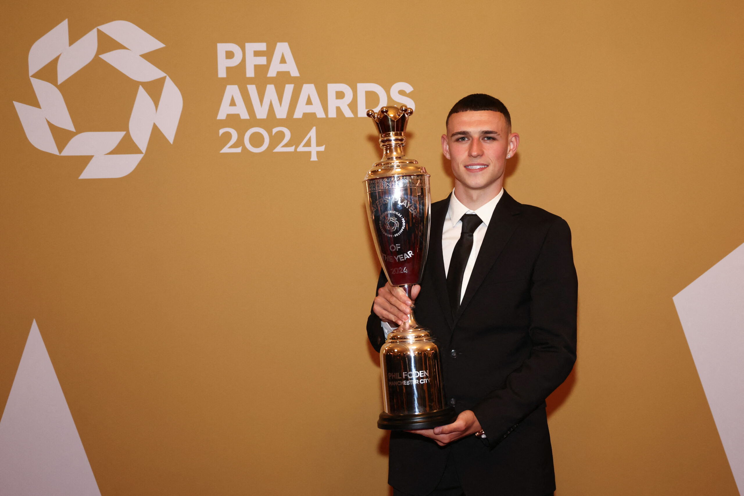 Phil Foden poses as Men's PFA Players' Player of the Year in 2024
