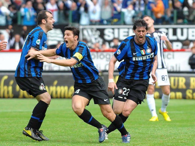 Inter Milan's Diego Milito celebrates his goal against Siena with Javier Zanetti and Goran Pandev in May 2010