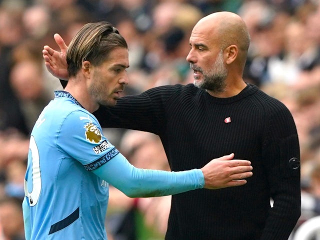 Manchester City's Jack Grealish with manager Pep Guardiola on September 28, 2024