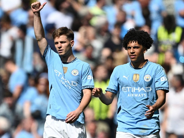 Manchester City's James McAtee with Rico Lewis on April 12, 2025