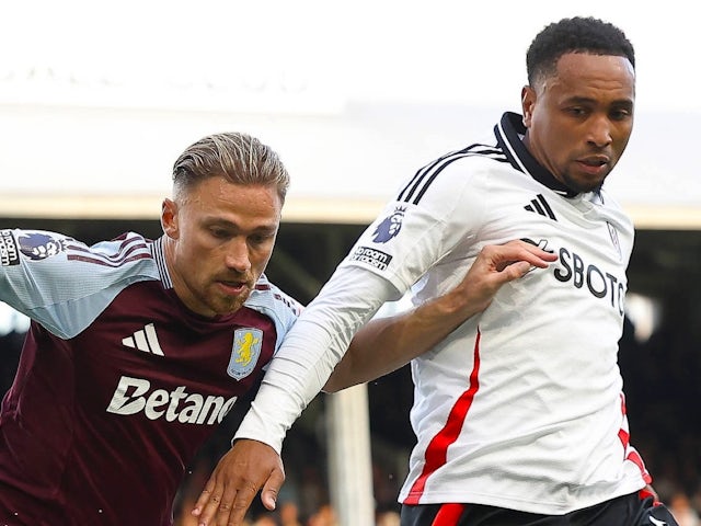 Aston Villa's Matty Cash in action with Fulham's Kenny Tete on October 19, 2024