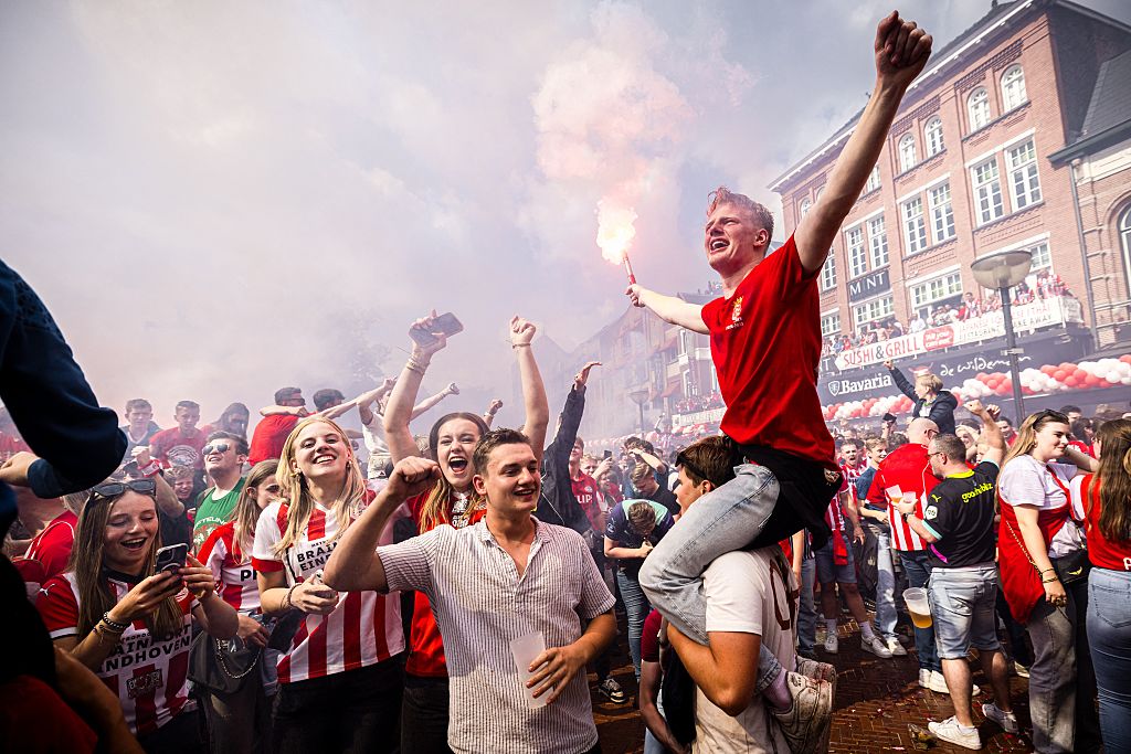 PSV's supporters celebrate in the streets of Eindhoven as the club secured the 2024/25 championship title after winning the Dutch Eredivisie football match between Sparta Rotterdam and PSV Eindhoven at Sparta Stadion Het Kasteel on May 18, 2025.