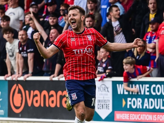 Ollie Pearce celebrates after scoring for York City on April 12, 2025