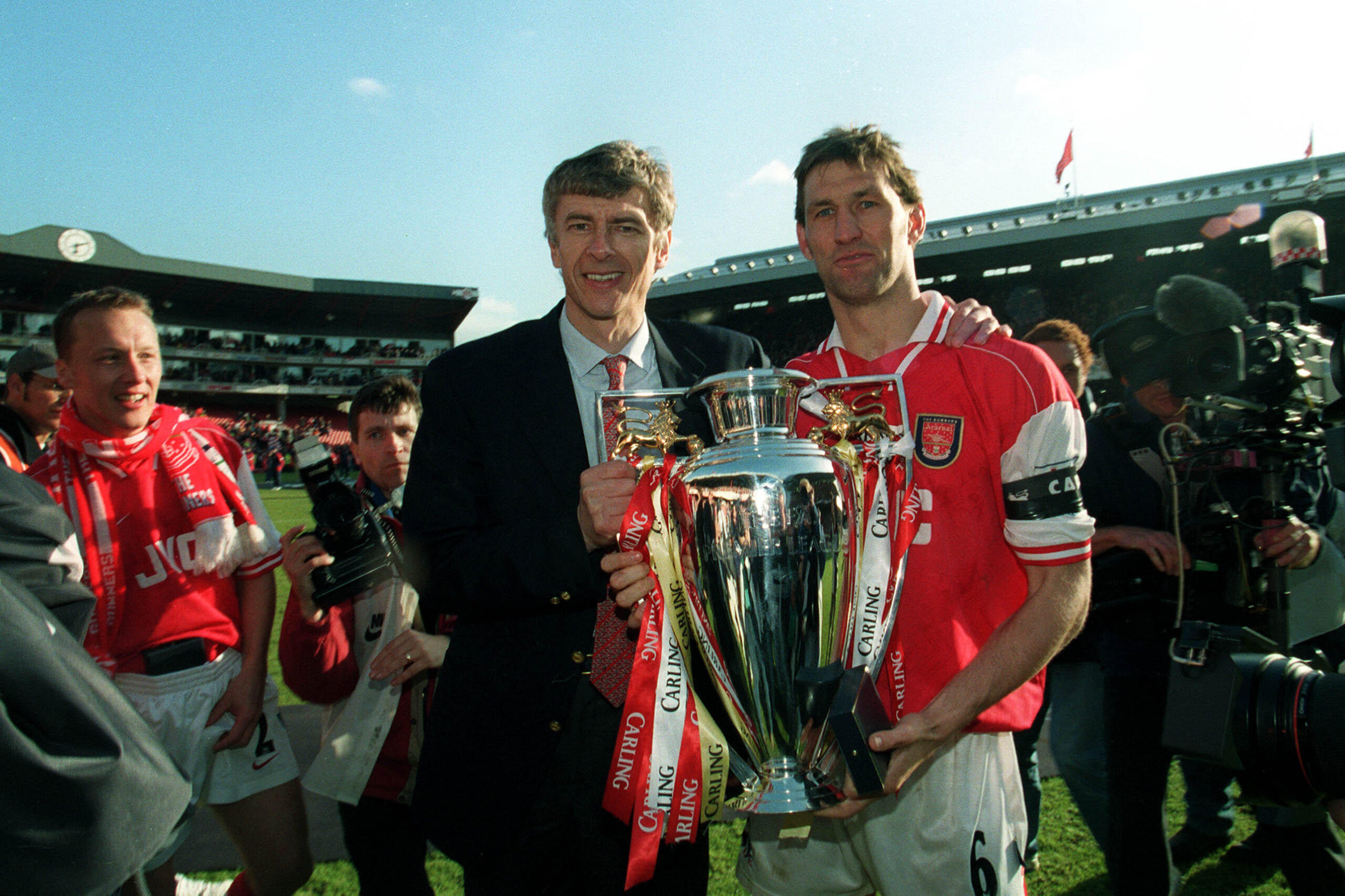 Arsenal manager Arsene Wenger and captain Tony Adams hold the Premier League trophy, May 1998
