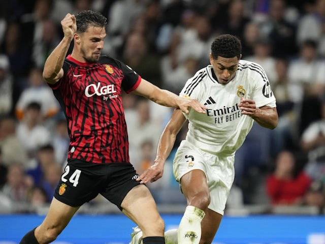 Real Madrid's Jude Bellingham in action with Mallorca's Martin Valjent on May 14, 2025