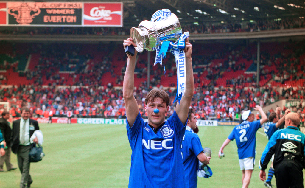 Everton forward Duncan Ferguson wearing a blue nose lifts the trophy to photographers after the 1995 FA Cup Final between Everton and Manchester United at Wembley Stadium on May 20, 1995 in London, United Kingdom.