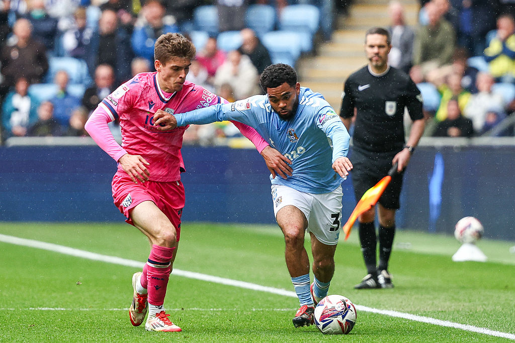 Jay Dasilva of Coventry City fight for possession during the Sky Bet Championship match between Coventry City and West Bromwich Albion at the Coventry Building Society Arena in Coventry, on April 18, 2025.
