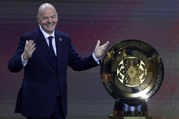 MIAMI, FLORIDA - DECEMBER 05: FIFA President Gianni Infantino presents The FIFA Club World Cup Trophy during the 2025 FIFA Club World Cup Draw at Telemundo Studios on December 05, 2024 in Miami, Florida.