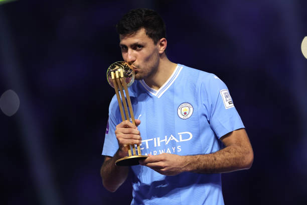 JEDDAH, SAUDI ARABIA - DECEMBER 22: Rodri of Manchester City kisses the Golden Ball award following the FIFA Club World Cup Saudi Arabia 2023 Final between Manchester City and Fluminense at King Abdullah Sports City on December 22, 2023 in Jeddah, Saudi Arabia.