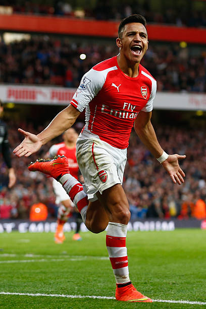 Alexis Sanchez soccer players who tuck their shirt in LONDON, ENGLAND - NOVEMBER 01: Alexis Sanchez of Arsenal celebrates scoring the first goal for Arsenal during the Barclays Premier League match between Arsenal and Burnley at Emirates Stadium on November 1, 2014 in London, England